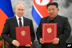 Керманичі Росії та Північної Кореї після підписання нового договору про поглиблене партнерство. Червень 2024 року