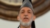 Outgoing Afghan President Hamid Karzai addresses a gathering of government employees at the Presidential Palace in Kabul, September 23, 2014.