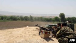 Afghan National Army soldiers engaged in a battle with Taliban insurgents in Kunduz on May 3.
